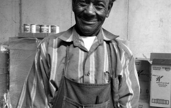 Smiling man wearing an apron